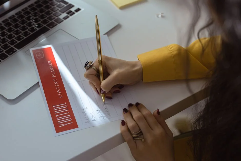 Close-up of a notebook page with Social Media Marketing handwritten on it.